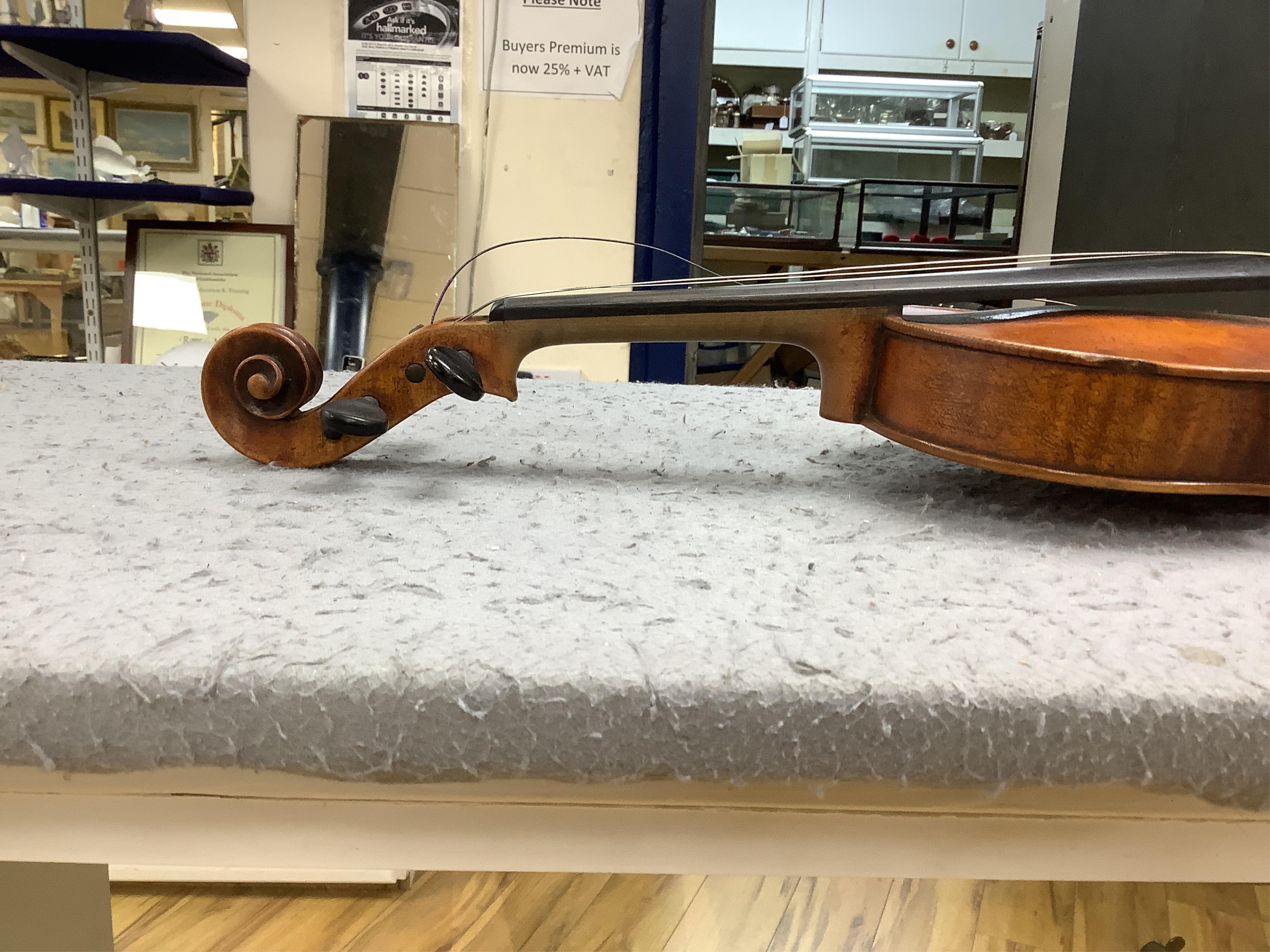 A late 19th cased century French unmarked violin and bow, body 35cm high.